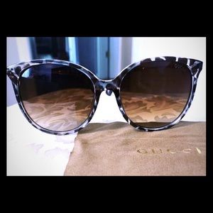 New! Gucci sunglasses with a case.
